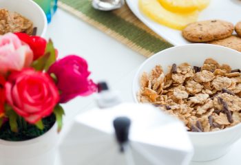 Portrait of continental breakfast with croissants, orange juice and coffee.