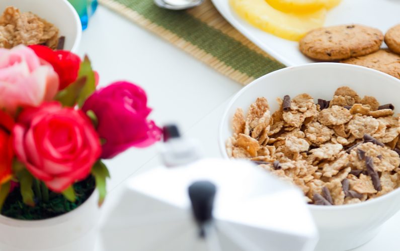 Portrait of continental breakfast with croissants, orange juice and coffee.